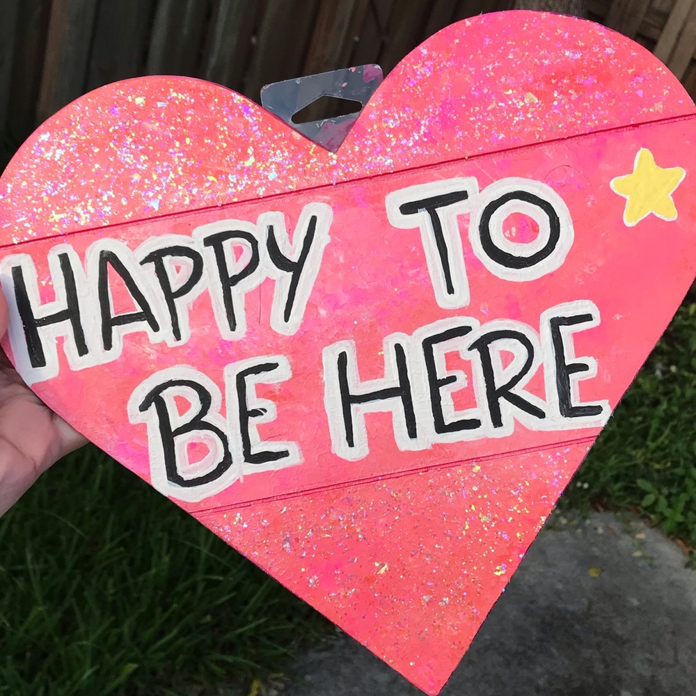 Wooden “Happy to be here” sign